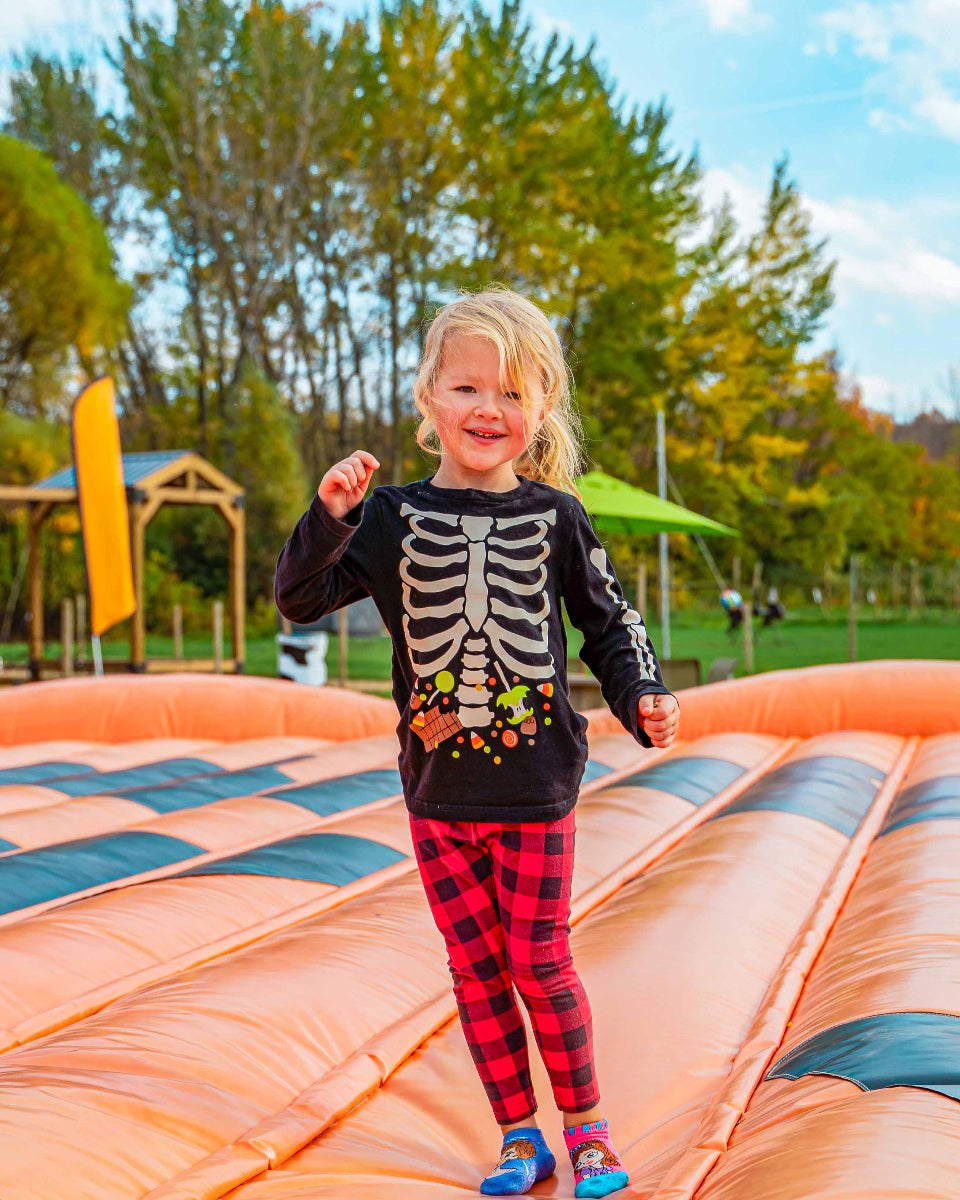 a young girl on a jumping pillow