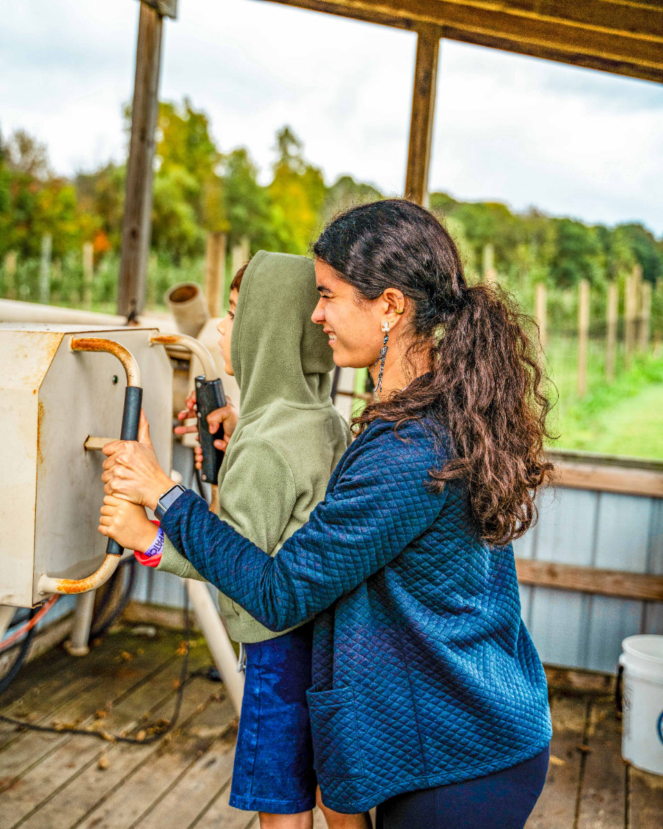 a mom and son use the apple cannons